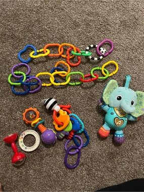 Baby Elephant Musical Plush Toy with Rainbow Link Rings - Teal/Multicolor